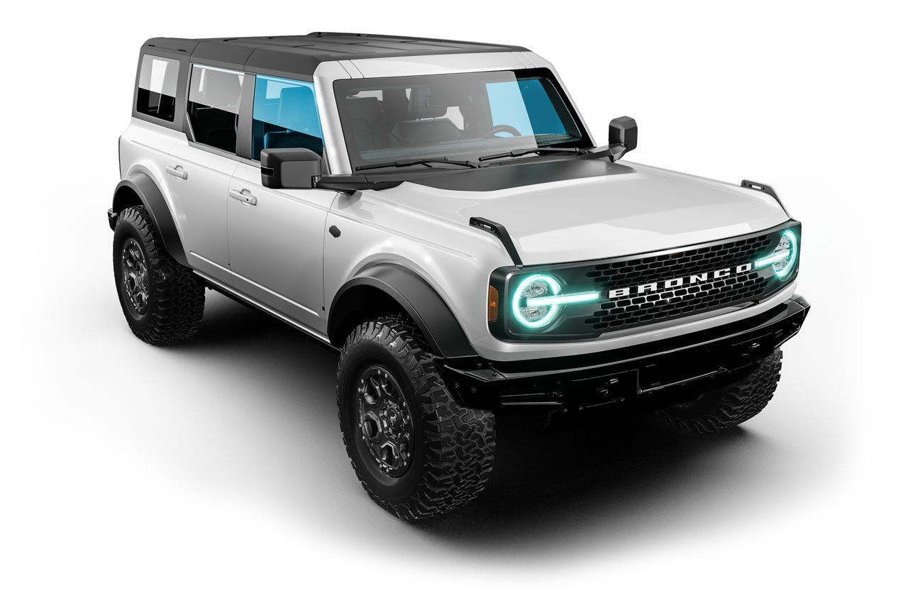 White Ford Bronco SUV with black accents, off-road tires, and tinted windows.