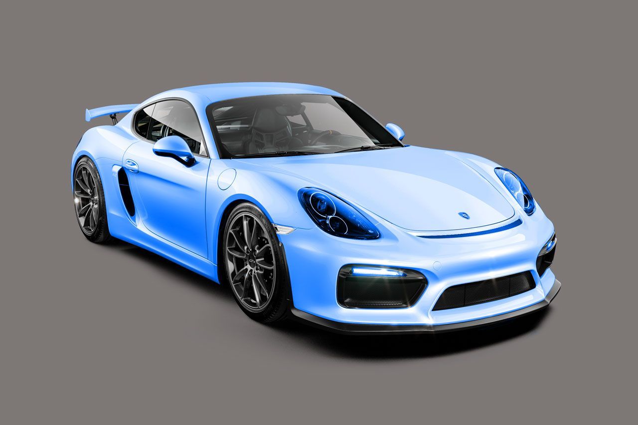Blue Porsche Cayman with a glossy, protected finish photographed against a gray studio background.