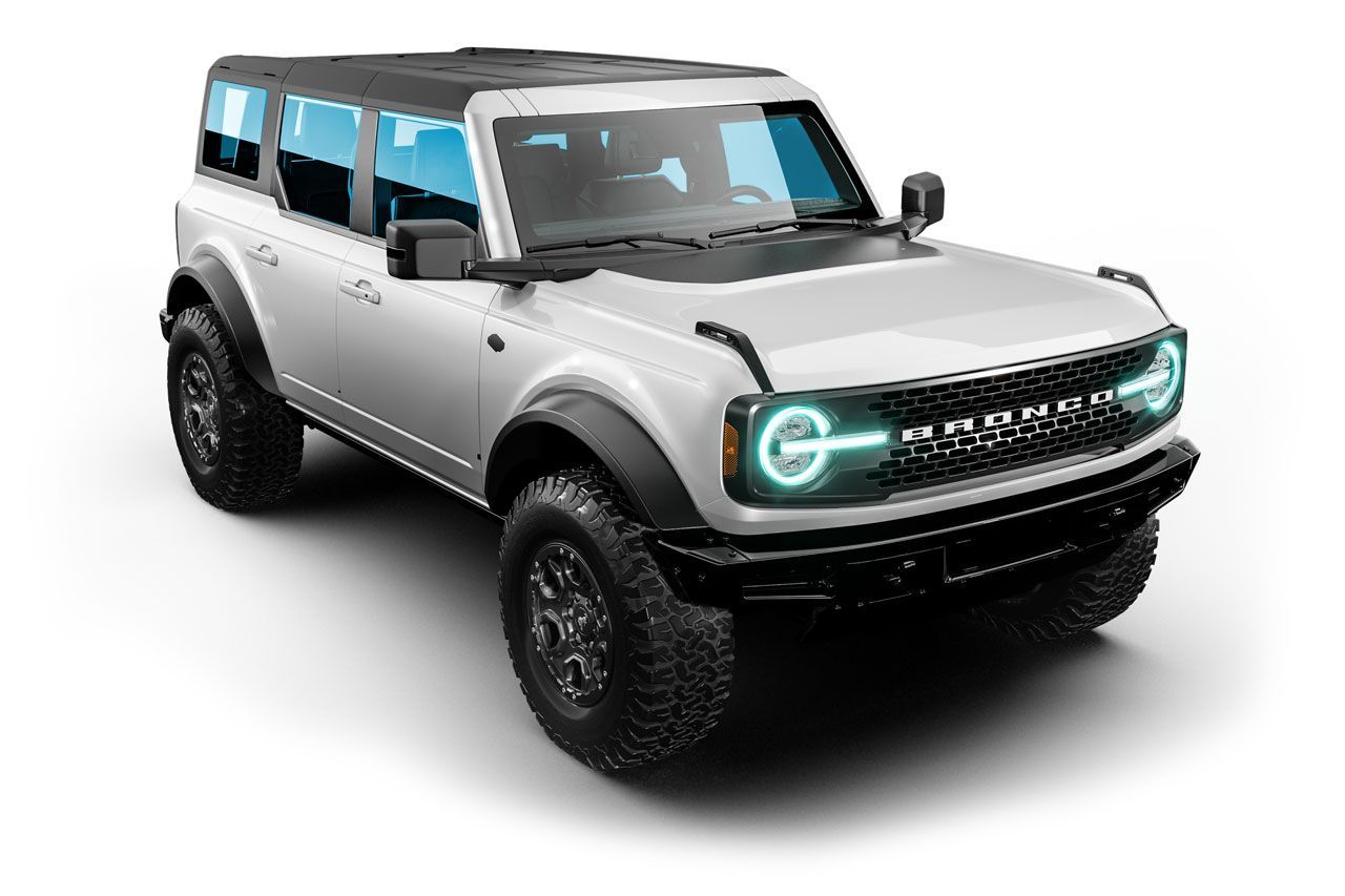 White Ford Bronco SUV with black accents, large tires, on a white background.